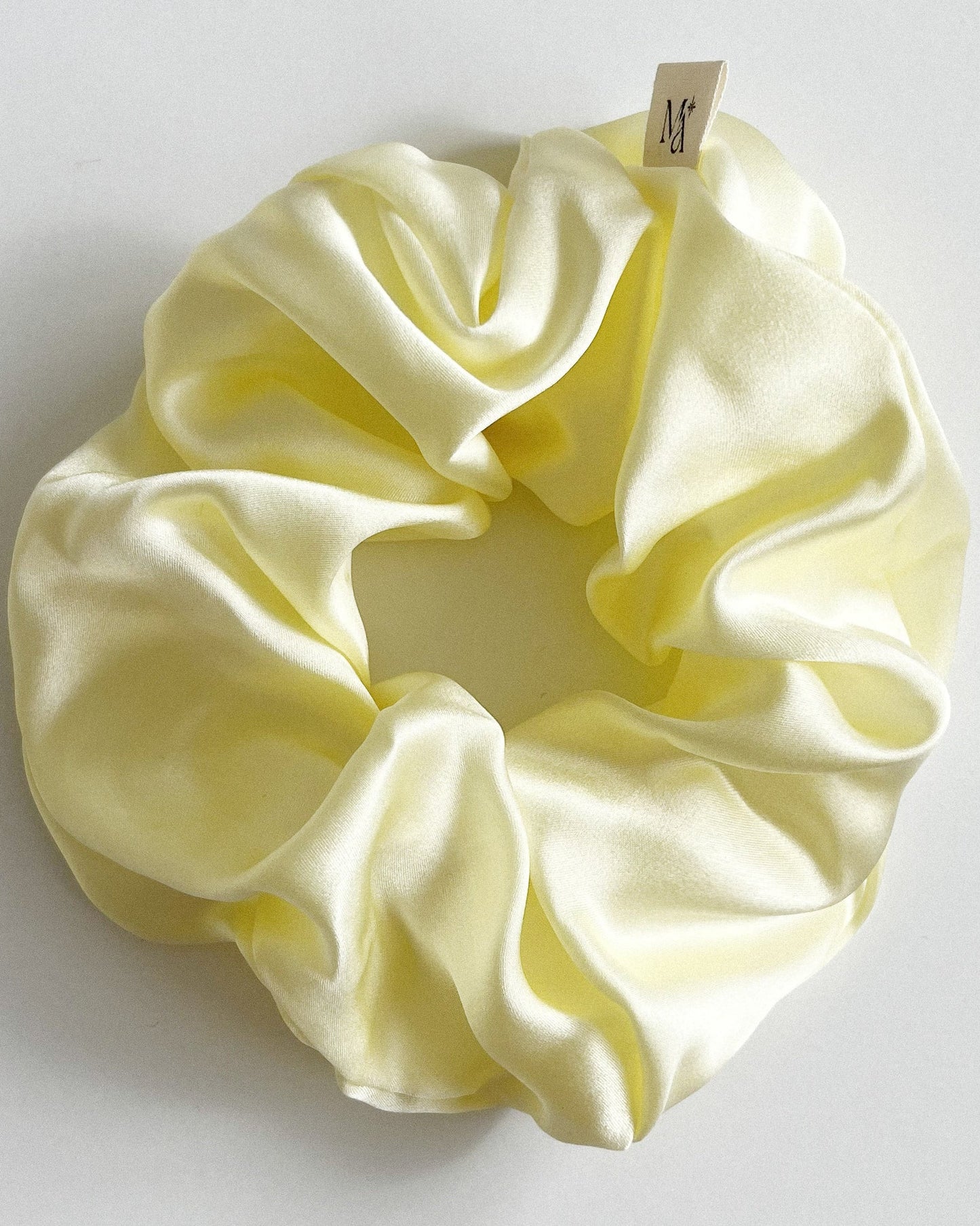 silk scrunchie butter yellow on white background