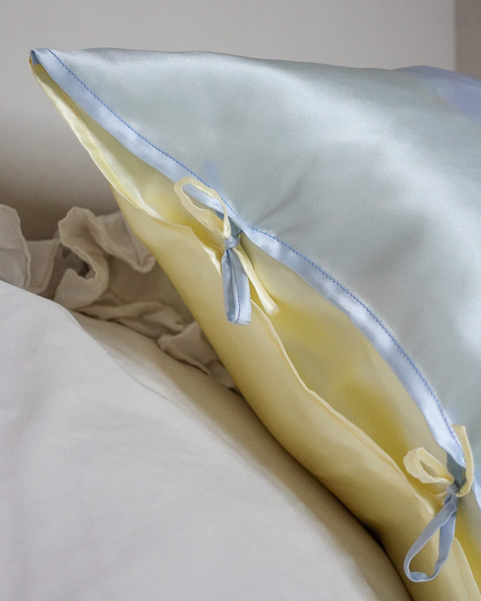 close-up on the closure of the silk pillowcase with delicate ties 