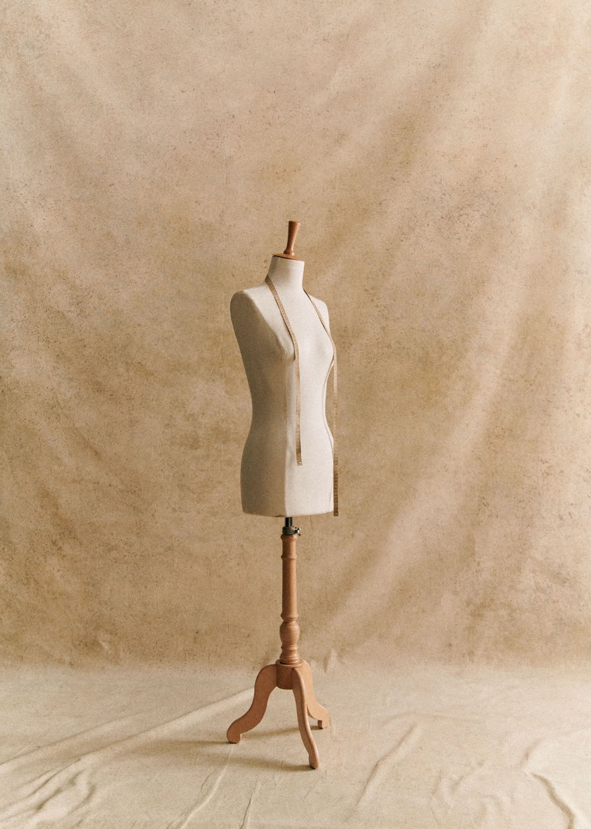 Stockman against a beige fabric background