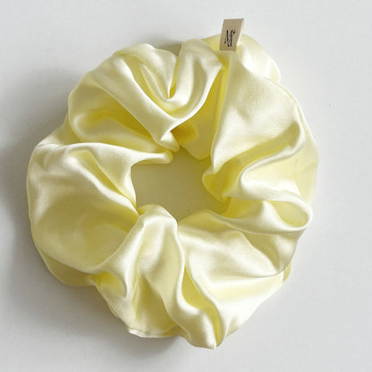 silk scrunchie butter yellow on white background
